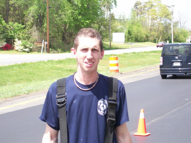 Firefighter/EMT Bellevou stops for a pose 